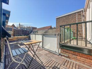 Roof terrace with a table and y chair, access from the Millchamber